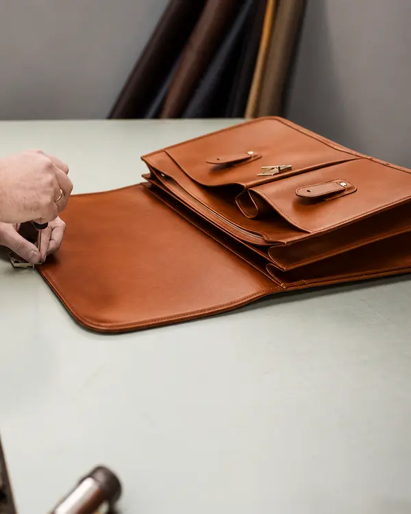 Men Quality Checking Leather Briefxase in Schott Leather Company