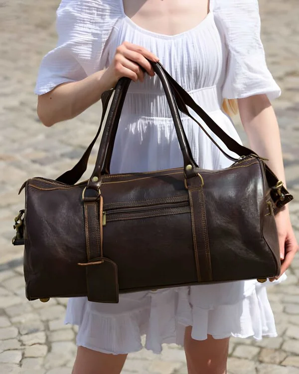 Women holding Leather Duffle Bag